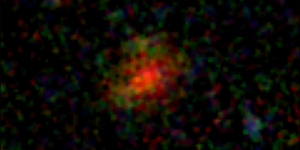 daily-telescope:-o-galaxie-antica-in-spatele-unui-val-de-praf