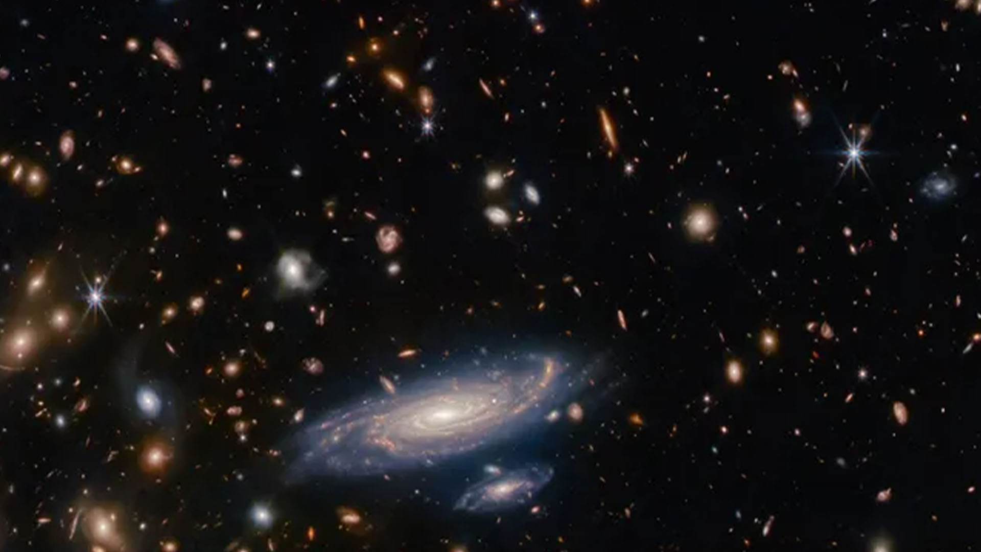 telescopul-james-webb-descopera-„galaxia-din-interiorul-exteriorului”-aproape-de-zorii-timpului